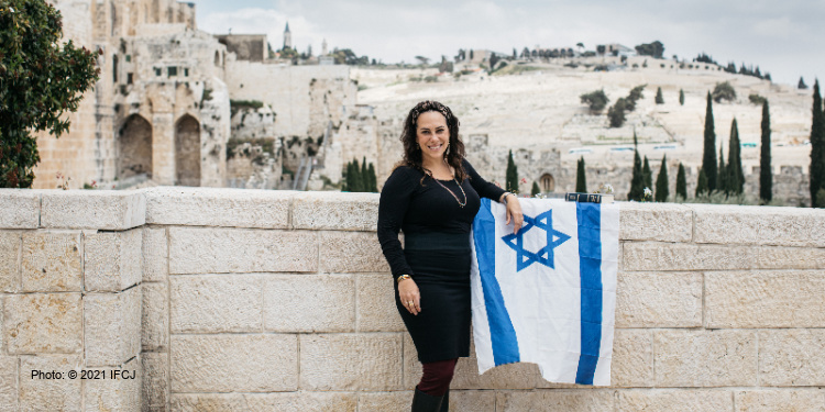 Yael Eckstein with Israeli flag in Holy Land of the Bible