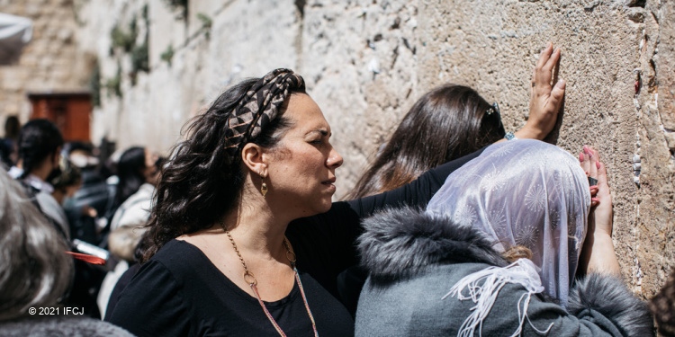 Yael praying at Western Wall, Temple Mount, Jerusalem Old City, illustrates Tisha B'Av