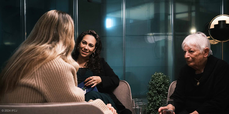 Yael speaking with two survivors from the October 7th war