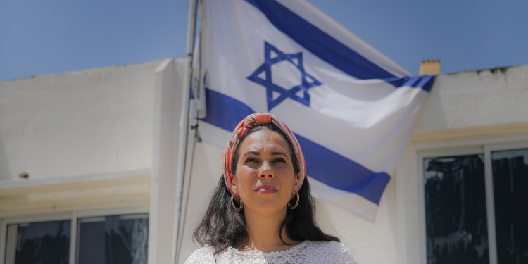 Yael Eckstein, Fellowship President and CEO, with Israeli flag illustrates a woman of strength