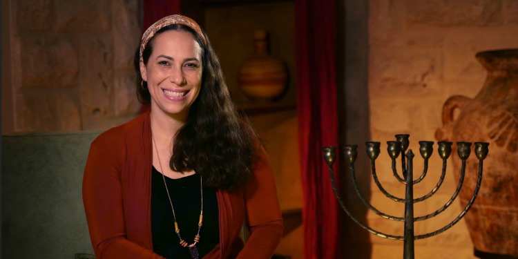 Yael Eckstein with Hanukkah menorah