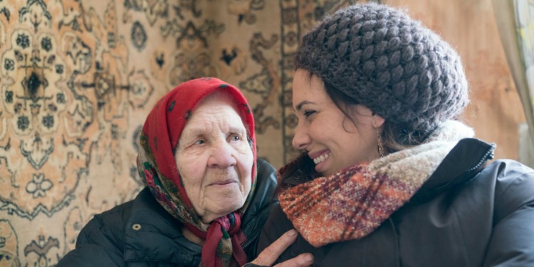 Yael Eckstein smiling at an elderly Jewish woman.