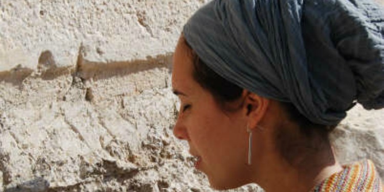 Yael Eckstein's side profile as she's praying at the Western Wall.