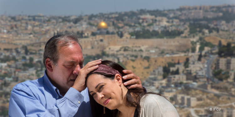 Yael Eckstein being blessed by her father, Rabbi Yechiel Eckstein, in Jerusalem