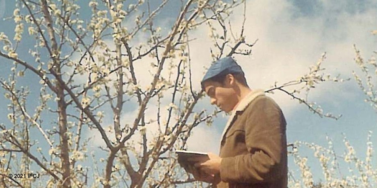 A young Rabbi Eckstein reading in the Holy Land