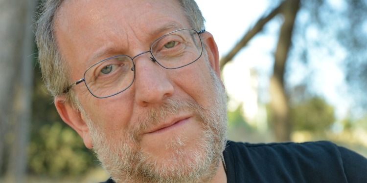 Headshot of a man looking directly at the camera.