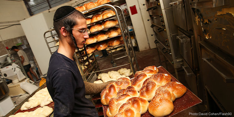 Jews preparing Challahs for a Sabbath at Rabbi Yeshayele bakery in the northern Israeli city of Tzfat,