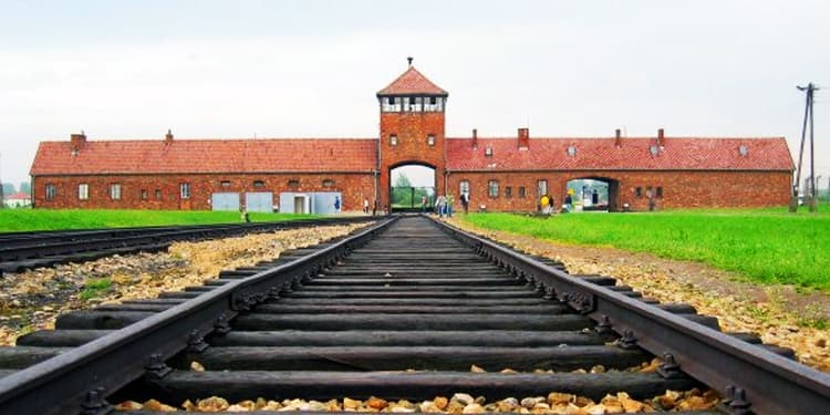 A building that goes over a train track.