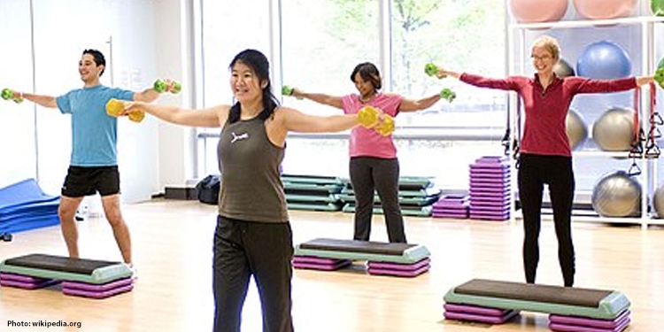 People in a step class excercising