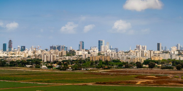 City in Israel with buildings and blue sky in the background.