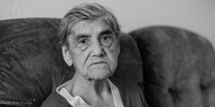 elderly needy woman frowning black and white