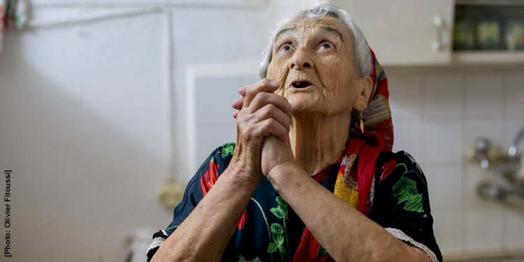 Elderly Jewish woman in Israel praying