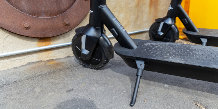 Close up image of the bottom part of an electronic scooter.