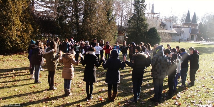 group of people standing in unity