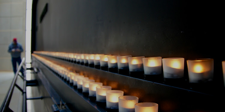 Two rows of candles serving as a memorial for those in the Holocaust.