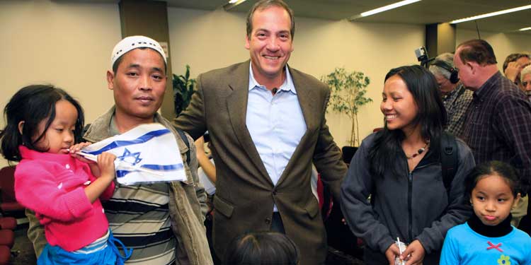 Rabbi Eckstein with an Iranian family that just made Aliyah.