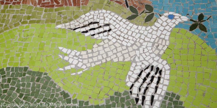 Mosaic tiles of a dove that has a branch in its mouth