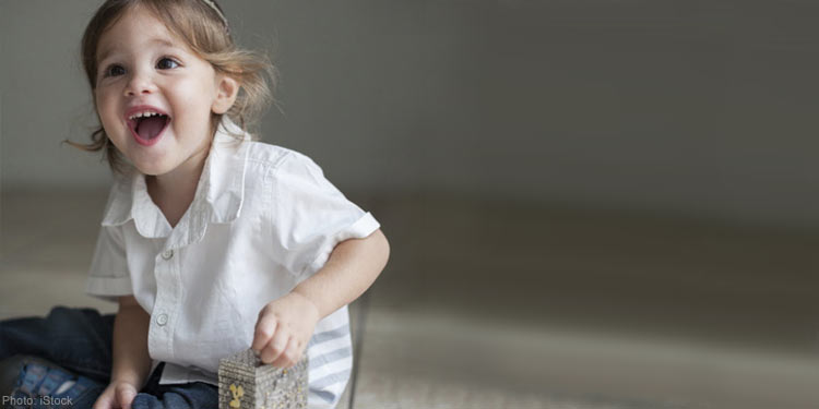 little boy with tzedakah box