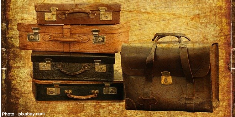 Drawing of four luggage bags stacked on top of each other next to a briefcase standing up.