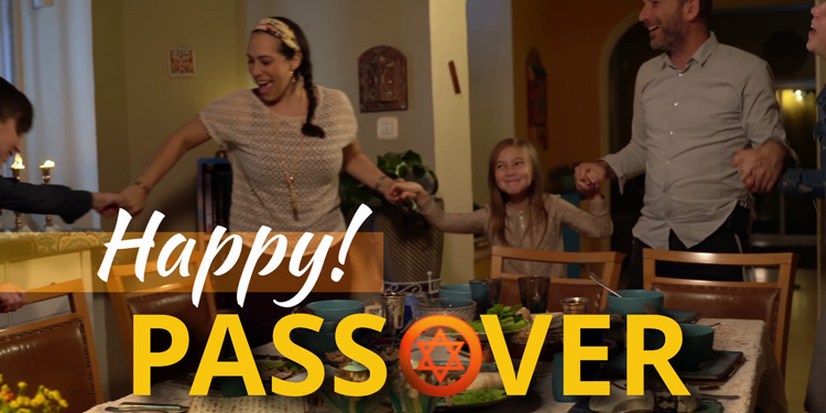Yael Eckstein and her family gathered at the table holding hands during Passover.