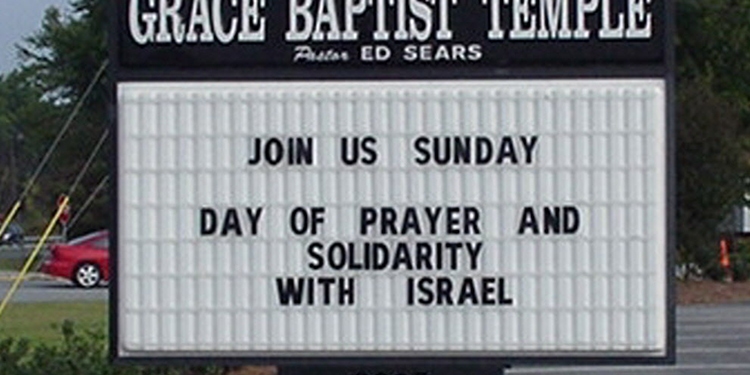 A road sign for the Grace Baptist Temple that reads Day of Prayer and Solidarity with Israel
