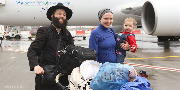 Jewish family who just made Aliyah from an IFCJ plane.