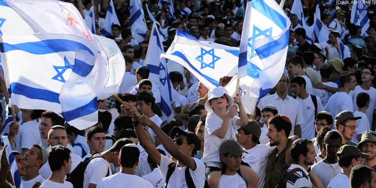 People demonstrate with Israeli flags