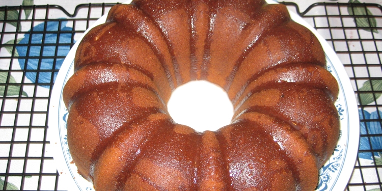 Close up image of honey cake on a white plate.