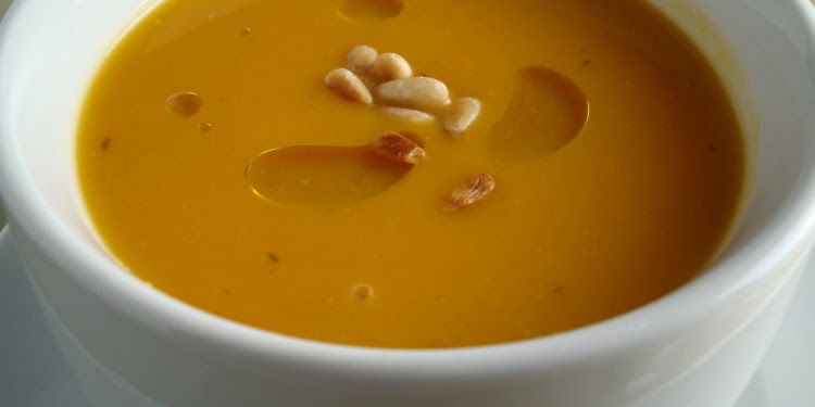 Spiced squash soup in a white bowl.