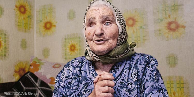Elderly woman, holding hands together