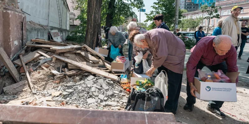 Ukrainians sorting through rubble