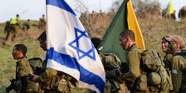 Israeli Soldiers carrying the flag of Israel through a field