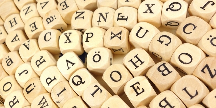 Wood cubes that have letters on them.