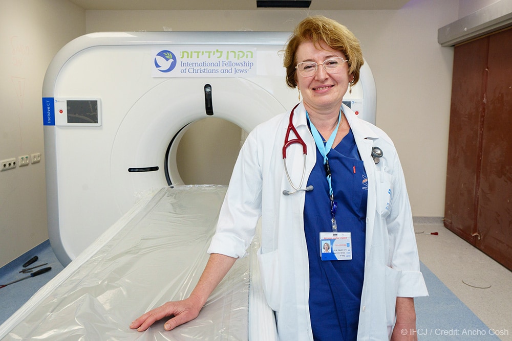 Doctor stands in front of new CT scanner for a fortified protected room in the emergency room